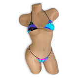 Mannequin wearing a colorful bikini set on a white background