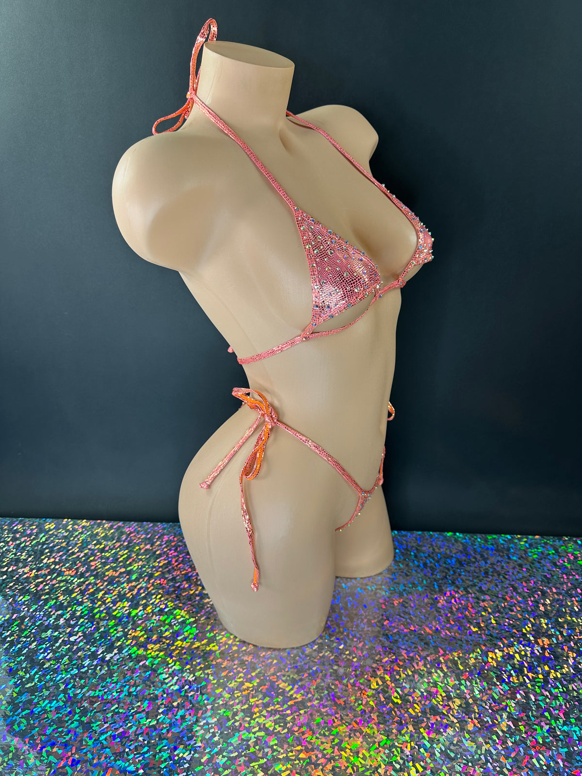 Citrus orange Aja rhinestone 'kini with tie-side thong, side view on dark background - Golddiggers Boutique