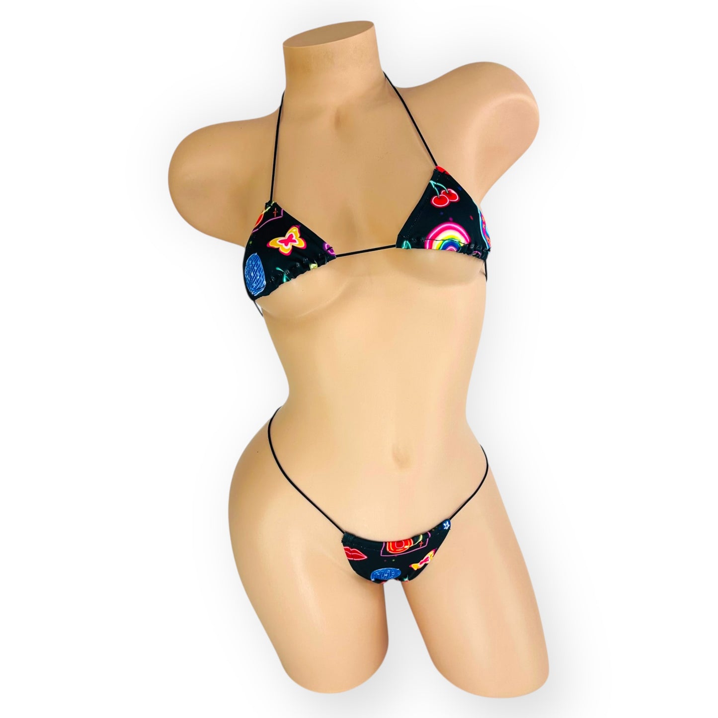 Neon Lights micro kini front view on mannequin showing neon print detail — Golddiggers Boutique