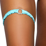 Aquamarine baby blue o-ring ruched tip garter worn on the thigh, Golddiggers Boutique
