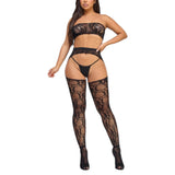 Model wearing black lace lingerie set on a white background