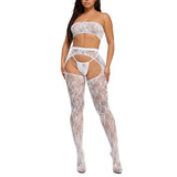 Woman wearing a white lace bodysuit on a white background