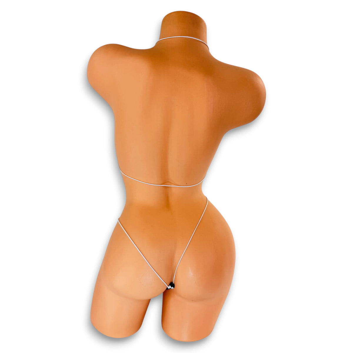 Back view of Black and White Polka Dot micro 'kini on mannequin showing white elastic string ties and g-string back