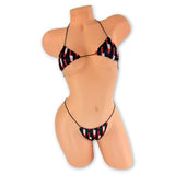 Front view of Bloody Knives micro 'kini on mannequin, black bloody knife print triangle top and g-string on black strings