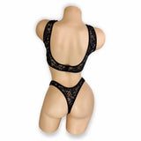 Back view of Caroline black lace set on mannequin showing wide scoop back and rhinestone lace thong back