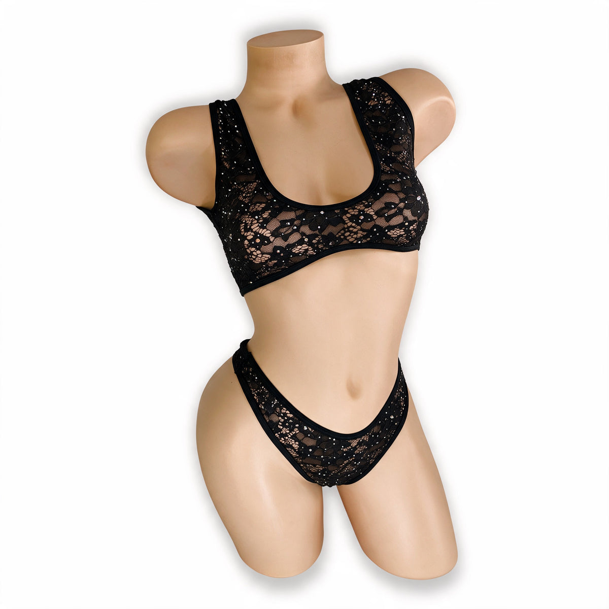 Three-quarter view of Caroline black rhinestone lace bralette and thong on mannequin, exotic dancewear