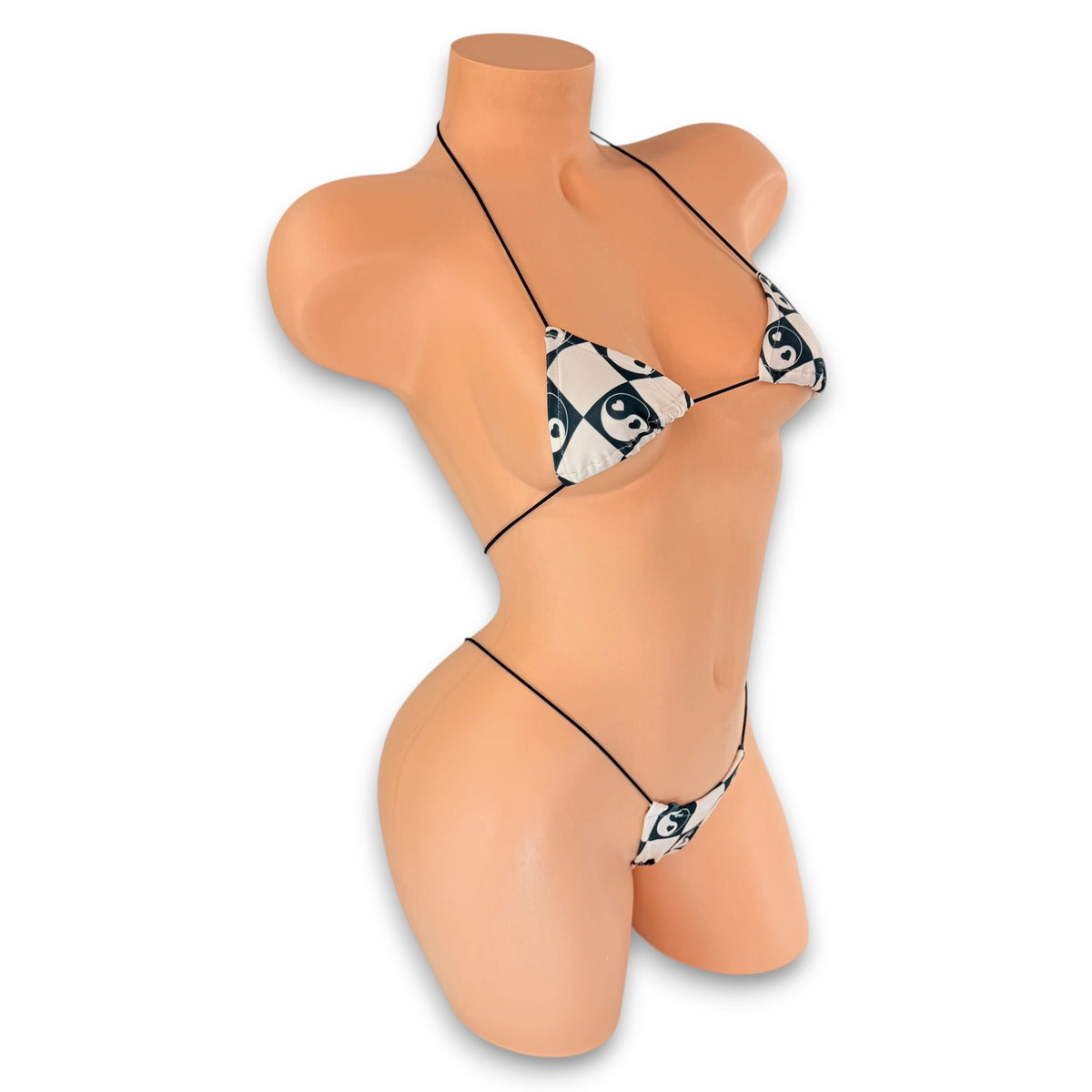 Side view of Checkerboard YinYang micro 'kini on mannequin, retro checkerboard exotic dancewear