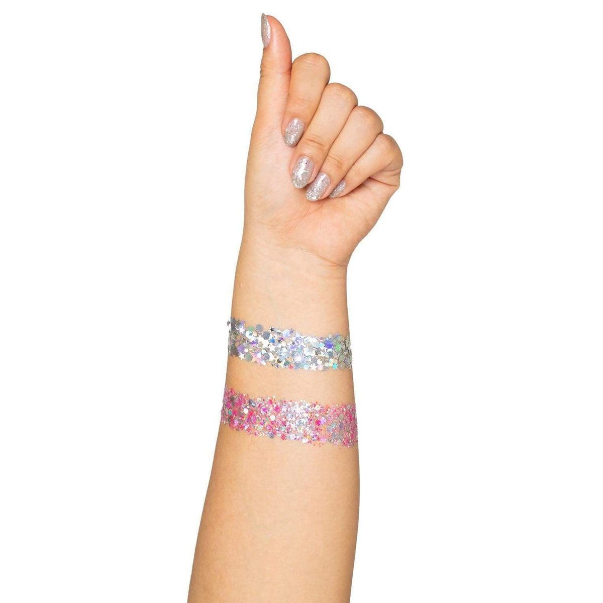 Detail view of the silver and pink body glitter swatched on an arm - Golddiggers Boutique