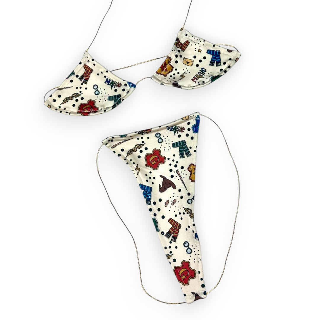 Wizard micro 'kini, flat lay of triangle top and g-string thong on white strings, Golddiggers Boutique