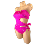 Fuchsia Elodie bodysuit side view with the cutouts and bow ties at the hip