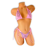 Front view of Gigi pink rhinestone butterfly bikini on mannequin, jeweled butterfly wings on top and butterfly on tie side bottom