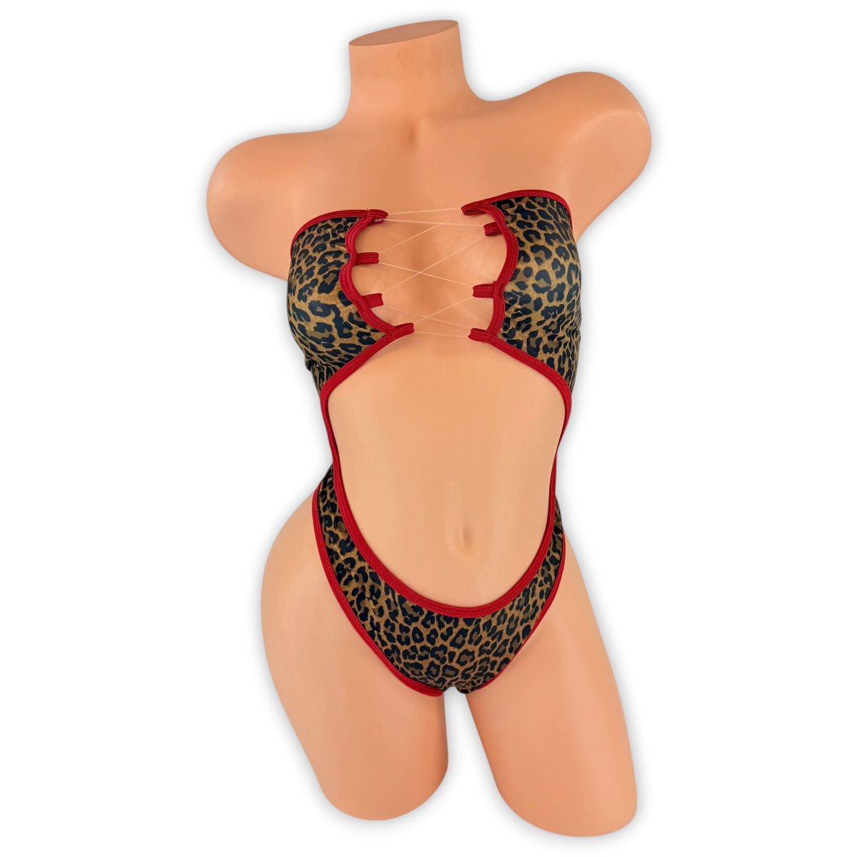 Leopard Tatum strapless bodysuit with red trim and clear elastic lace-up front, front view on mannequin