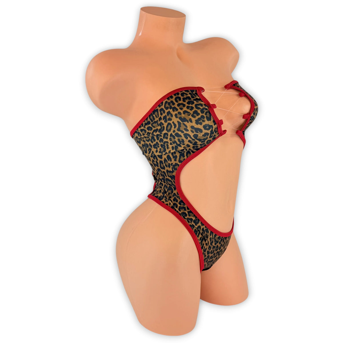 Leopard Tatum bodysuit side view showing the cut-out waist and red trim
