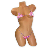 Pink birthday cupcake print micro 'kini with lilac strings on mannequin, front view - Golddiggers Boutique