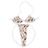 Pink champagne print micro 'kini top and g-string, flat lay on white - Golddiggers Boutique