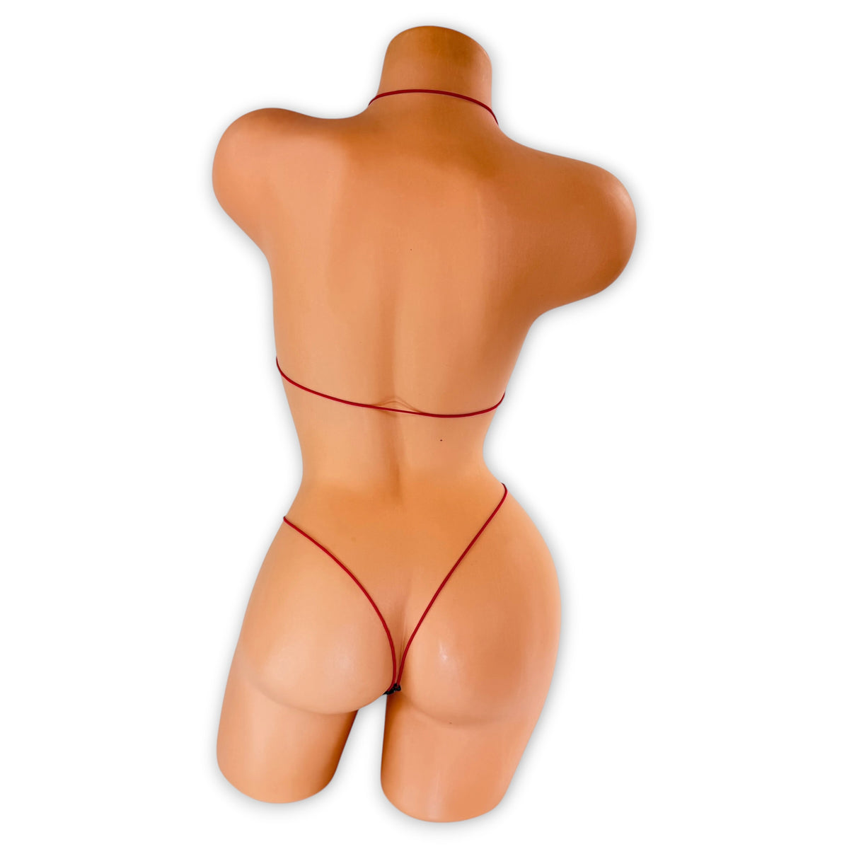 Back view of Pink Leopard Tropical micro 'kini on mannequin showing hot pink elastic string ties and g-string back