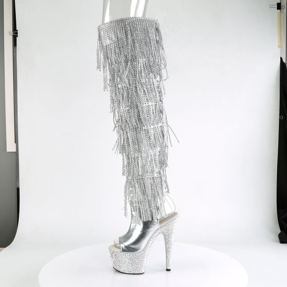 Pleaser 7 inch silver metallic rhinestone fringe platform over the knee boot, side view of the rhinestone platform and heel