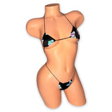 Reflective butterfly micro bikini, angled front view on mannequin with glowing print - Golddiggers Boutique