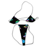 Reflective butterfly teeny tiny micro 'kini flat lay under flash, butterflies lit up in rainbow colors - Golddiggers Boutique