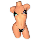Black reflective butterfly micro bikini and g-string on mannequin, front view with butterflies glowing - Golddiggers Boutique