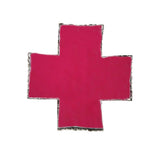Back of a rhinestone cross pasty showing the pink self-adhesive silicone backing