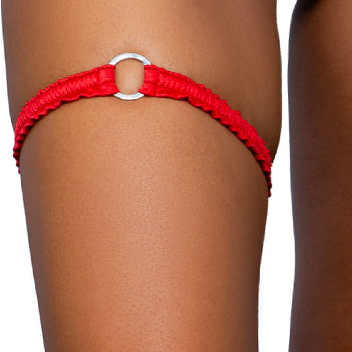 Ruby red o-ring ruched tip garter worn on the thigh, Golddiggers Boutique