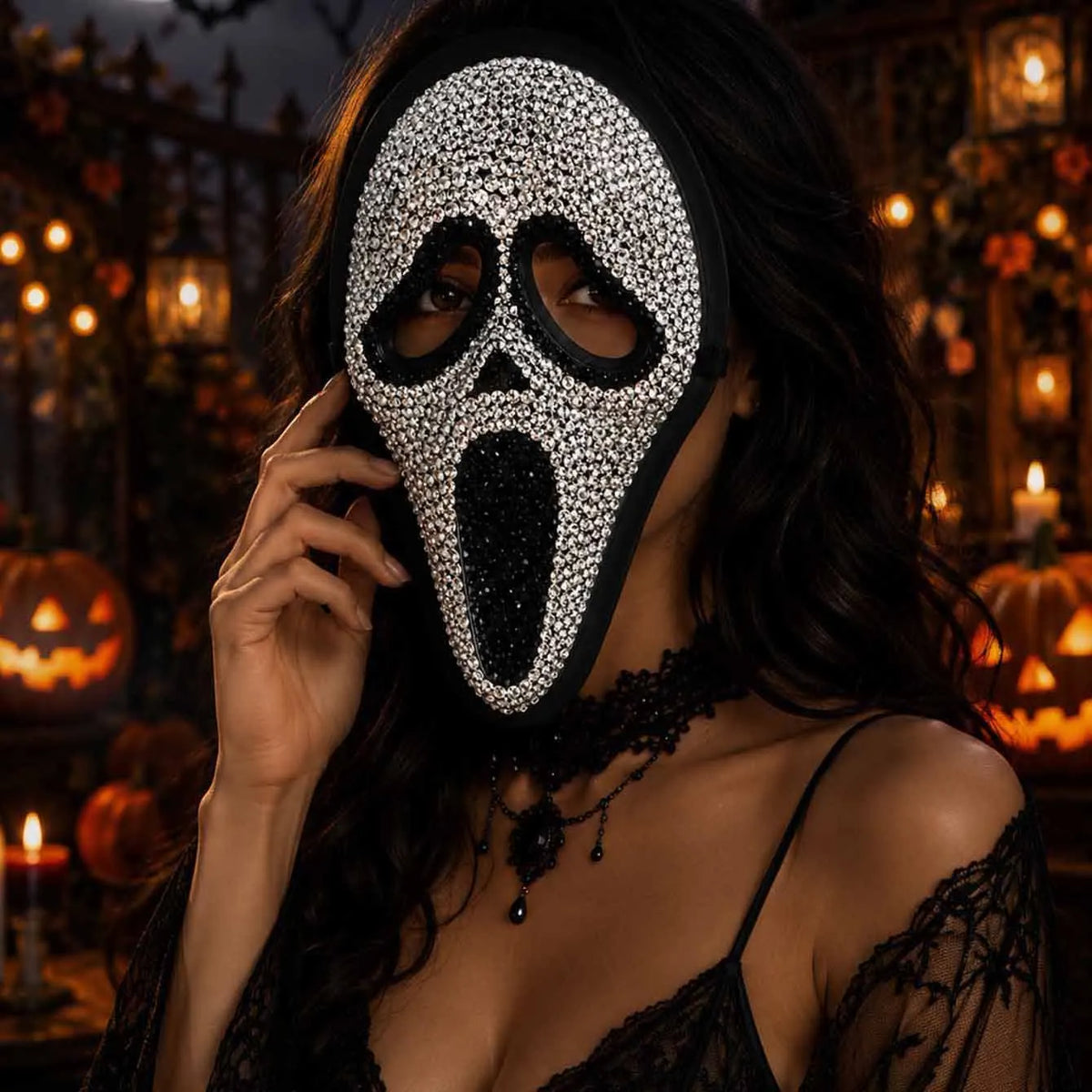 Silver rhinestone screaming skull mask worn with black lace, close-up - Golddiggers Boutique