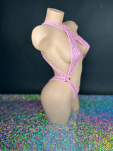 Bubble gum pink Ann criss-cross bodysuit, side view on dark background - Golddiggers Boutique