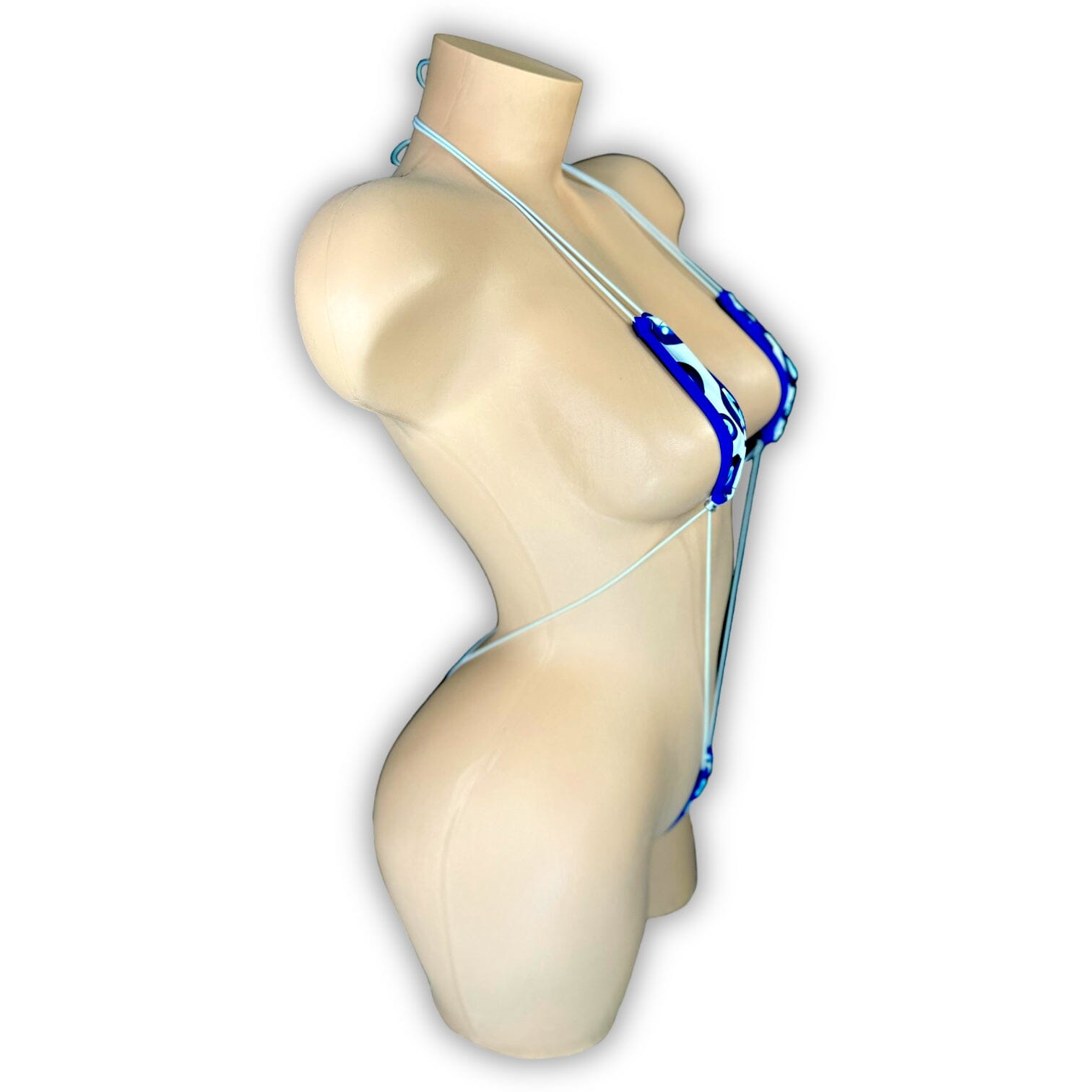 Evil Eye teeny tiny slingshot set flat lay showing minimal coverage design — Golddiggers Boutique exotic dancewear