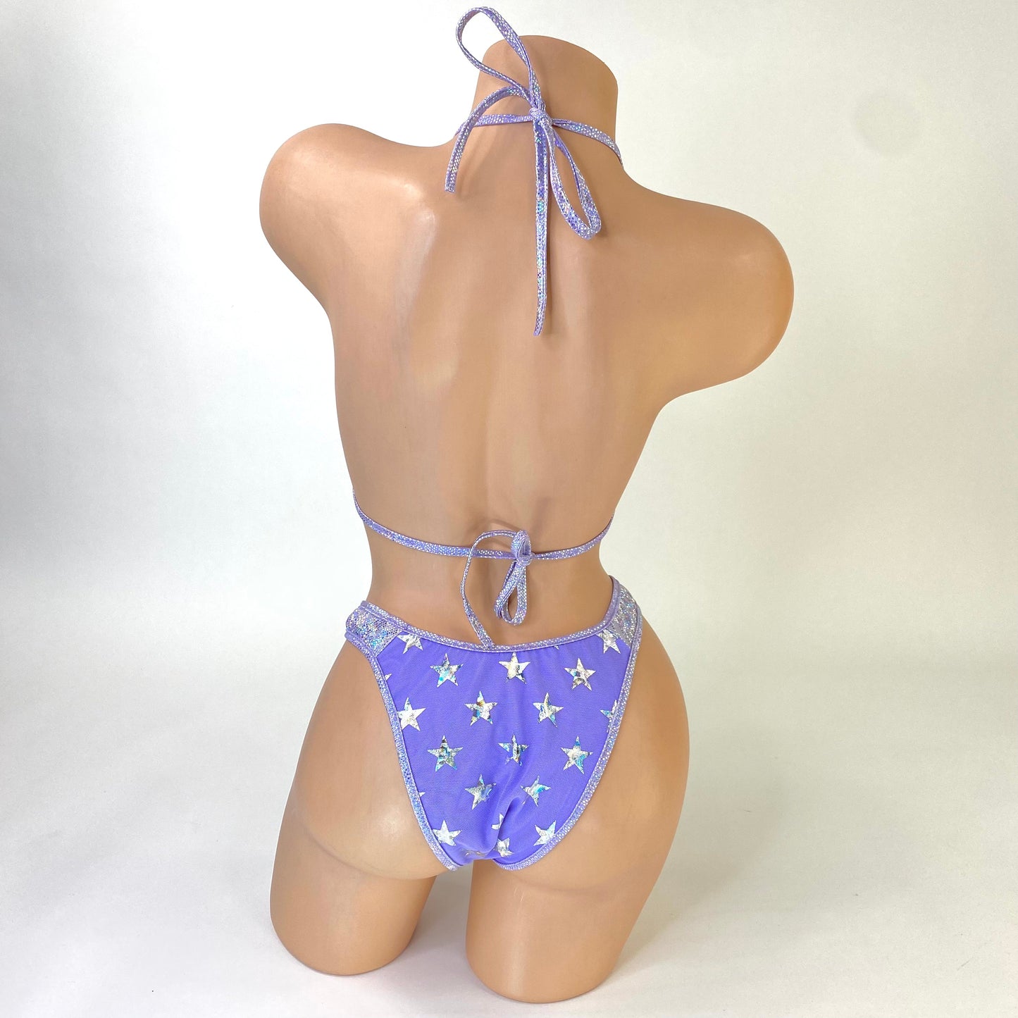 Stardust lilac mesh mini skirt with star detailing, back view — Golddiggers Boutique exotic dancewear