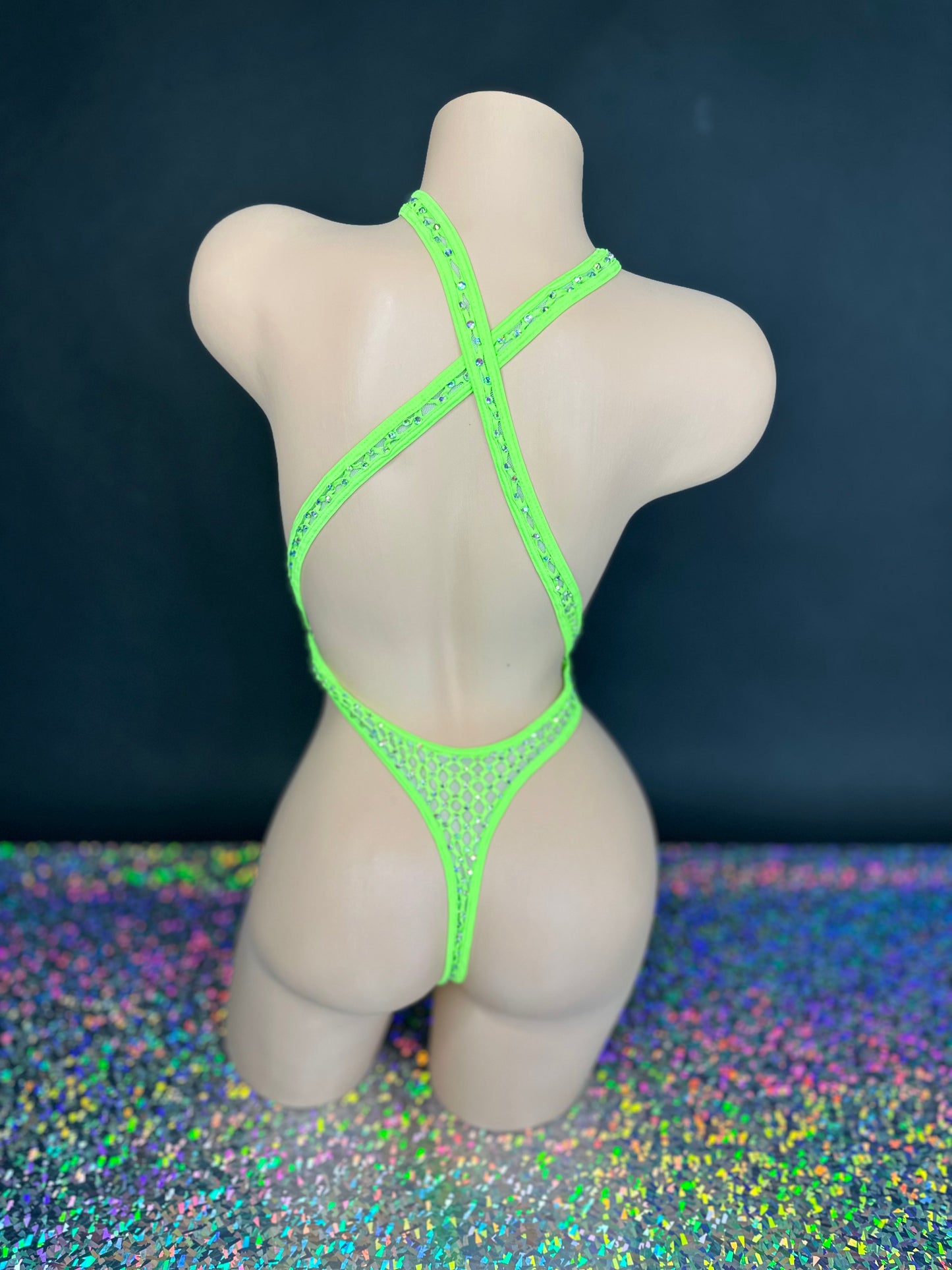 Lime green Ann criss-cross bodysuit, back view on dark background - Golddiggers Boutique