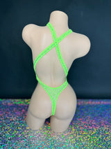 Lime green Ann criss-cross bodysuit, back view on dark background - Golddiggers Boutique