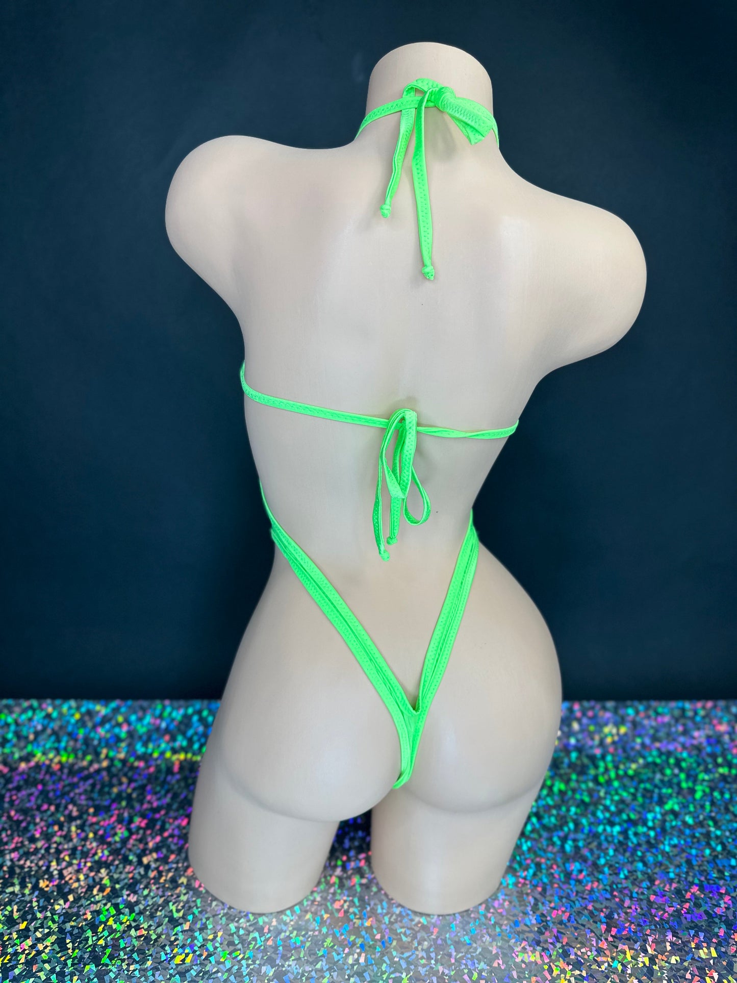 Kendall lime green rhinestone bodysuit detail shot of v-neckline and embellishments — Golddiggers Boutique exotic dancewear