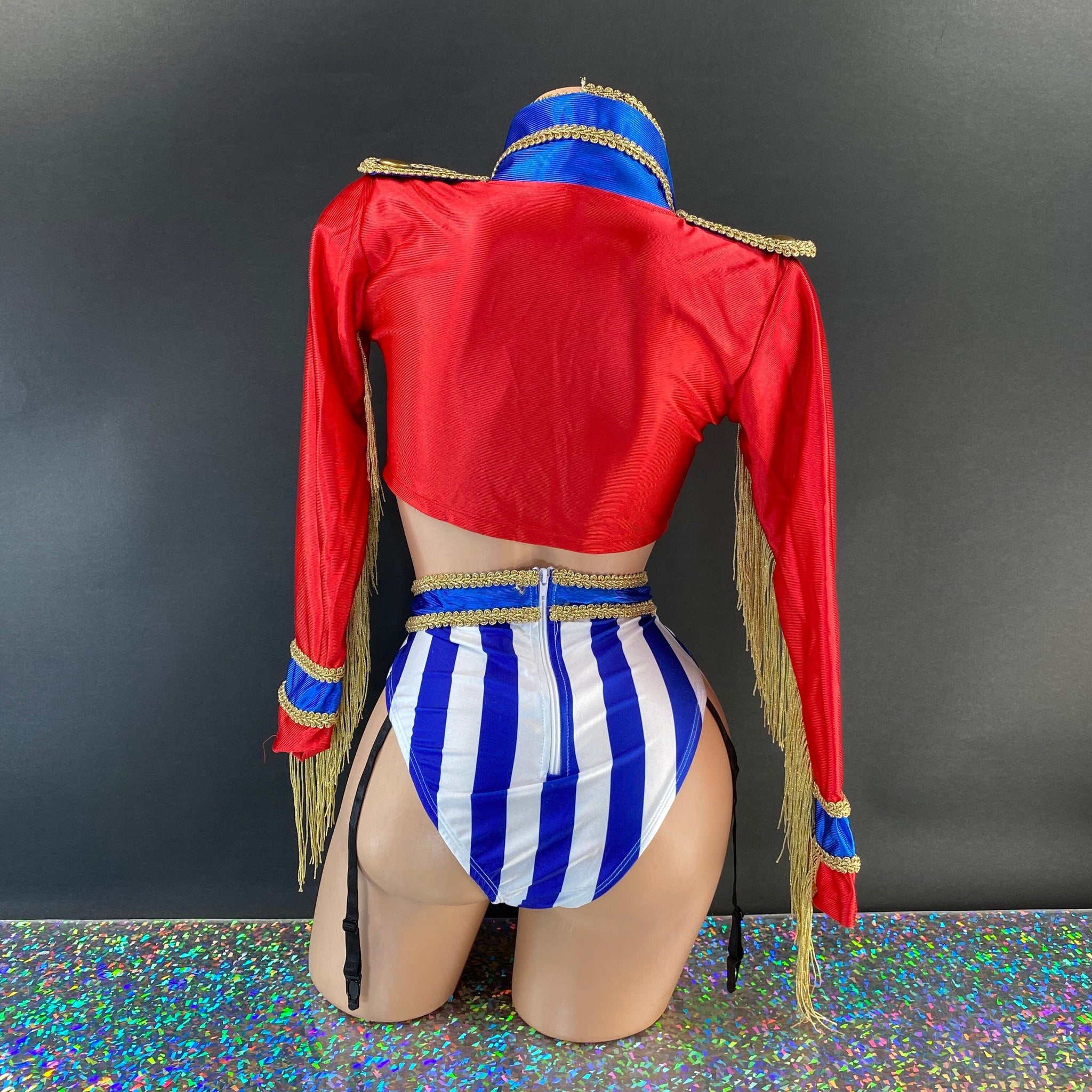 Complete ringmaster costume set with striped shorts flat lay — Golddiggers Boutique exotic dancewear