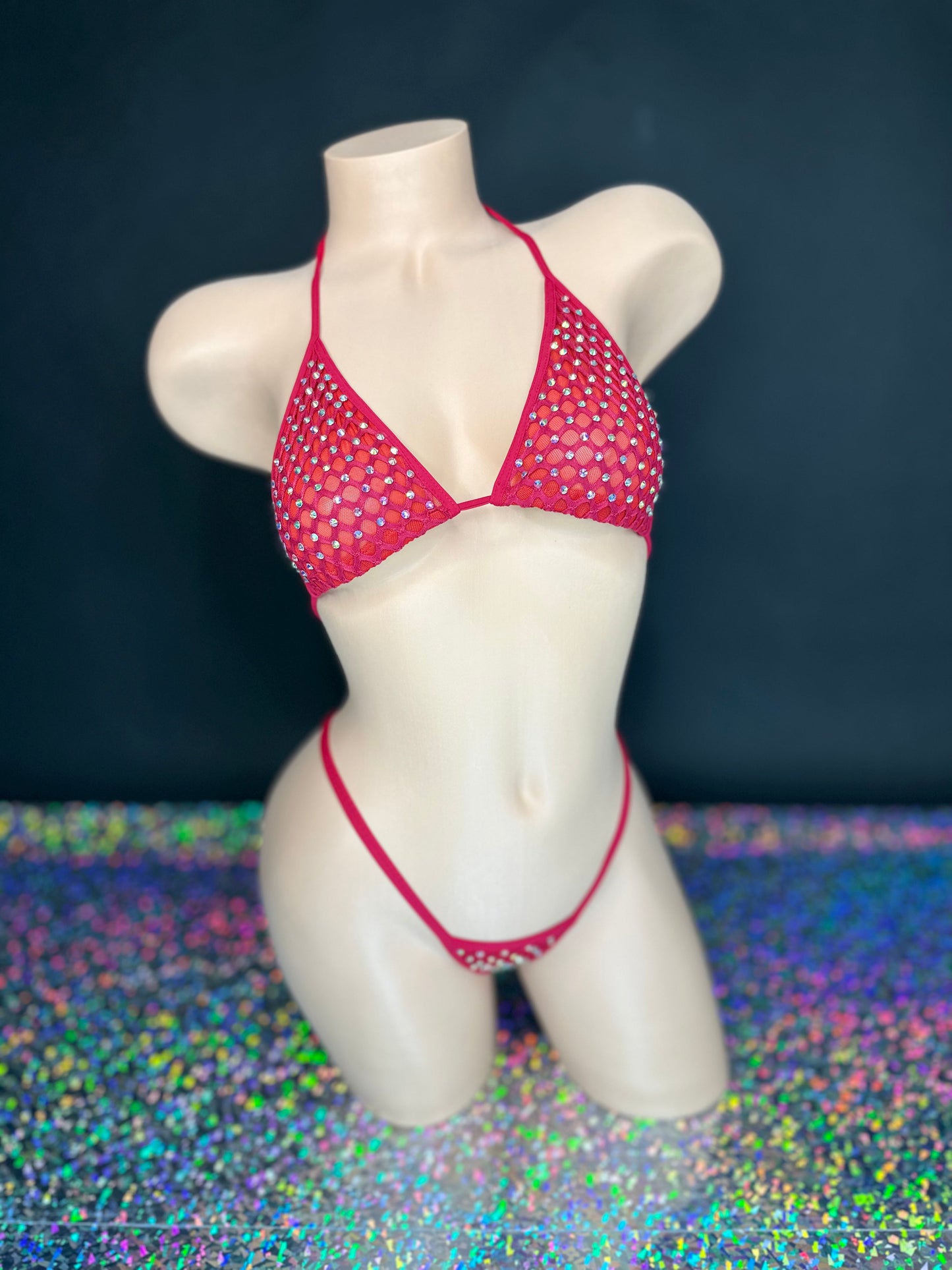 Red Katie rhinestone cabaret net 'kini, front view on dark background with holographic floor - Golddiggers Boutique