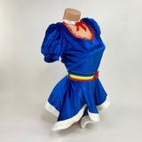 Side view of the royal blue velvet rainbow girl costume with red lace neckline and red sequin star belt