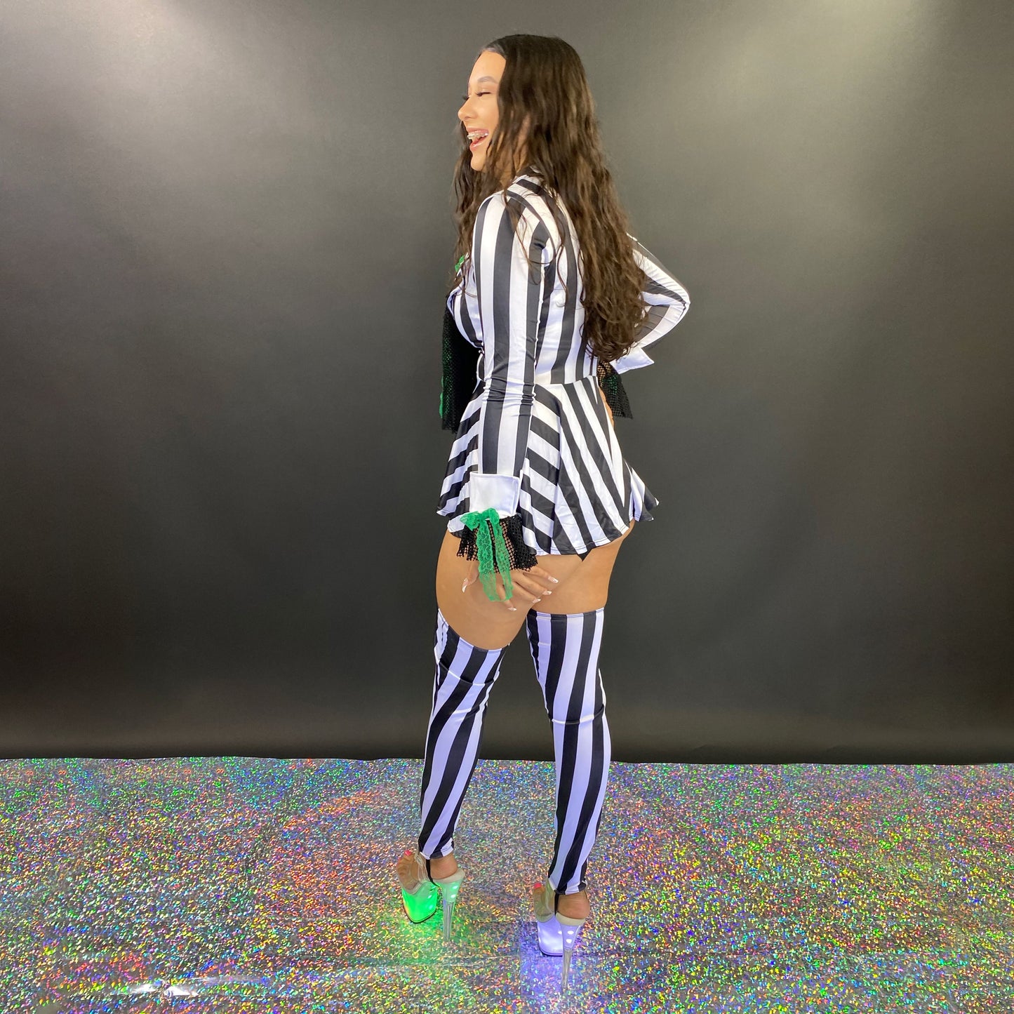 Halloween costume black and white stripes with accessories, flat lay — Golddiggers Boutique exotic dancewear
