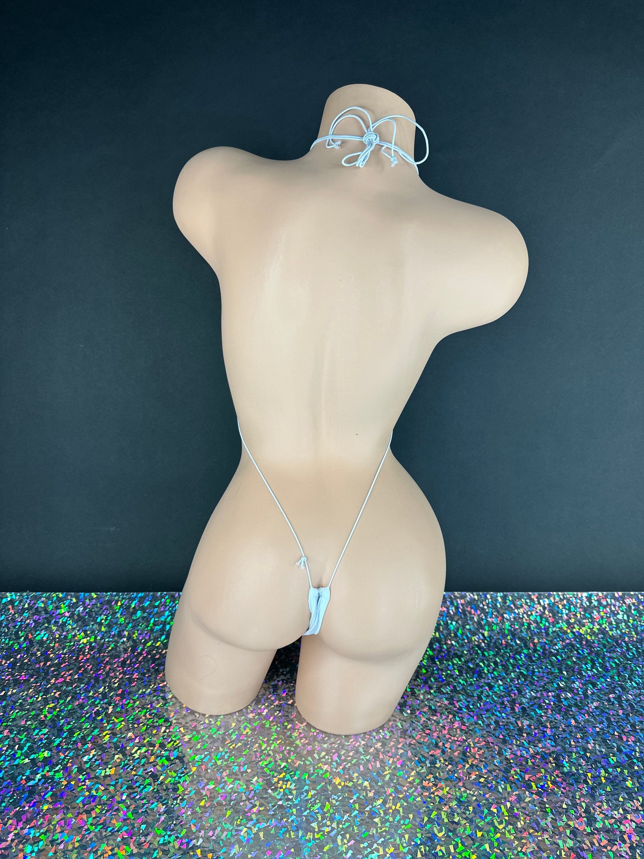 White sparkle slingshot bodysuit minimal coverage design, flat lay — Golddiggers Boutique exotic dancewear