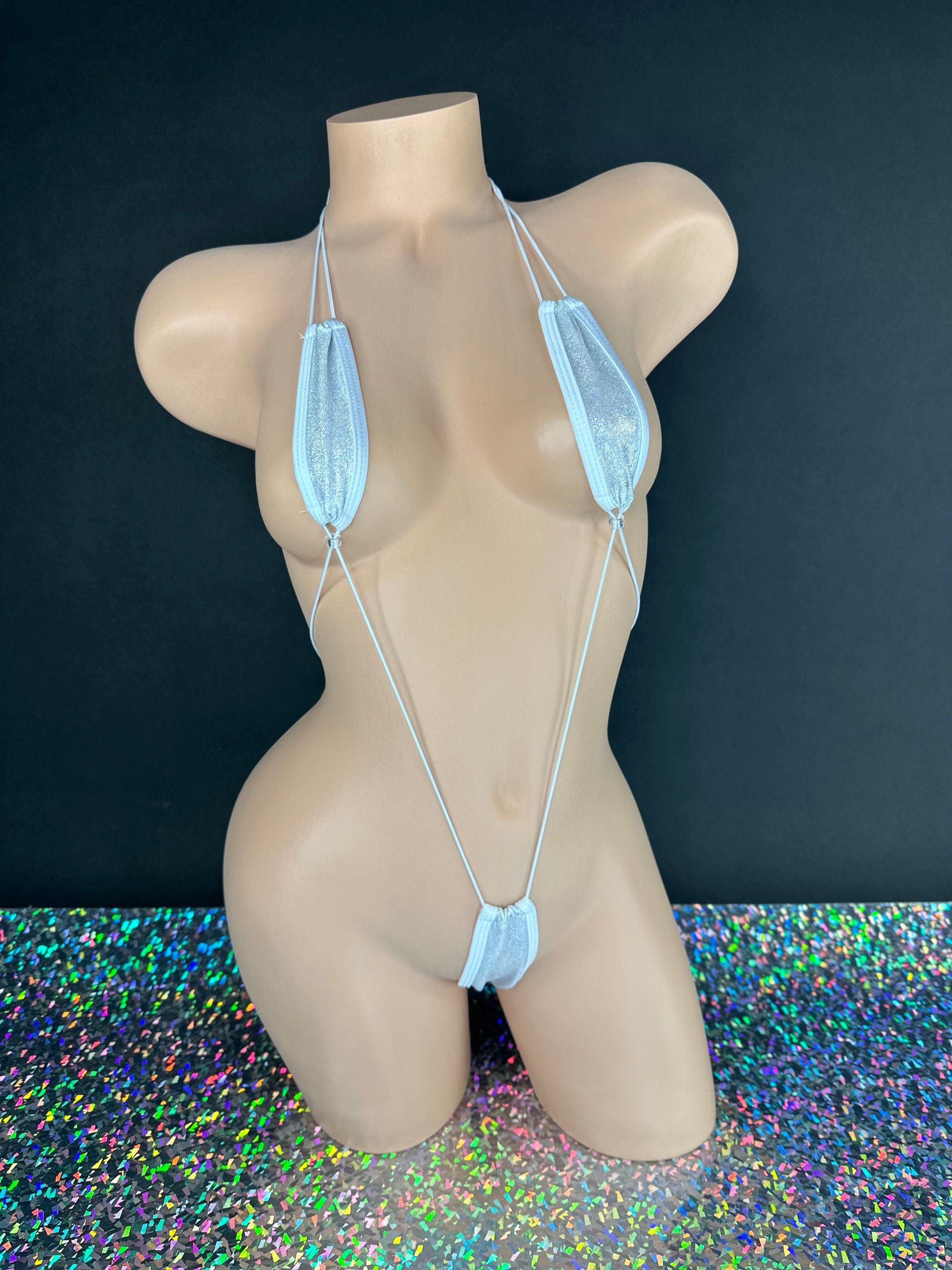 White sparkle slingshot bodysuit thong bottom detail, close-up — Golddiggers Boutique exotic dancewear
